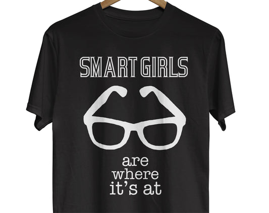 T-shirt with an image of eye glasses and text reading Smart Girls are Where It's At. Gift for book lovers, students, and geeks.
