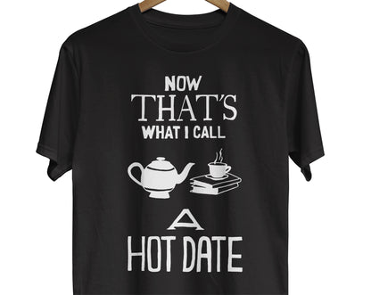 Bookworm t-shirt with text saying Now That's What I Call A Hot Date with an illustration of a teacup on a stack of books next to a teapot